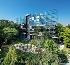 an office building in the middle of a park