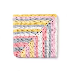 a multicolored crocheted blanket is folded on a white surface and it's diagonal stripes are visible