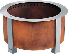 a round fire pit sitting on top of a metal stand