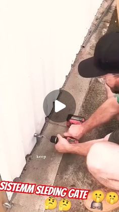 a man kneeling down on the ground with some tools