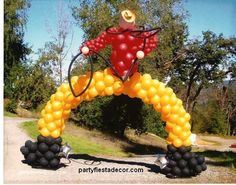 an inflatable balloon arch with a man on it