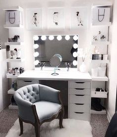 an instagram with a chair, mirror and lights on it's wall next to a vanity