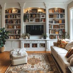 a living room filled with lots of bookshelves next to a couch and chair