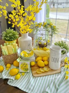 the table is set with lemons and other things to eat for dinner or as a centerpiece