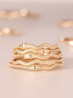 Our Sylvie Snake Stacking Ring is a finely detailed snake ring, with itty bitty gold scales. Looks excellent in a stack- we love a ring that adds motion and movement - or on its own. Part of our signature Sylvie Snake collection, a bevy of snakes gentle enough to warm the hearts of the snake-averse, and charming enough to charm the snake enthusiasts. Gold Scales, Snake Ring Gold, Catbird Jewelry, Gold Jewelry Gift, Snake Ring, Gold Snake, The Snake, Itty Bitty, Gifts For Wedding Party