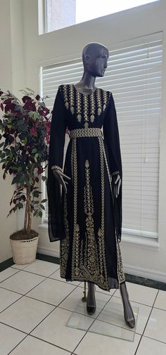 An Elegant Black Jordanian Palestinian Long sleeves Thobe Dress Kaftan Abaya with Gold Embroidery tatreez from the front and embroidered cape on sleeves and comes with a belt Embroidery Details are on the front as shown in the pictures & Video. Comes with a lining under the dress  Modern Design, Very high quality Materials. always the product in real much prettier than the picture. - Color : Black & Gold embroidery Size 1 ((Fits Small)) Bust : 38-40" inches Shoulders : 15.5 inches Length : 56.5 Belt Embroidery, Embroidered Cape, Kaftan Abaya, Dress Kaftan, Chiffon Sleeves, Dress Modern, Arab Women, Gold Embroidery, Modern Dress