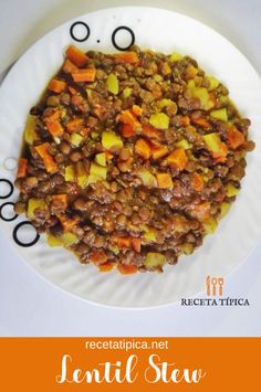 a white plate topped with meat and veggies