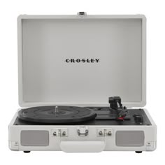 the crosley portable record player is open and ready to be used as a turntable