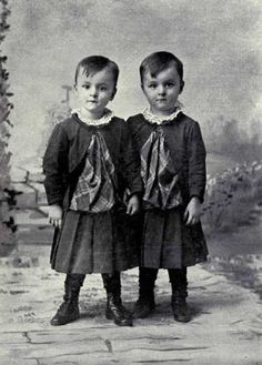 two young children standing next to each other