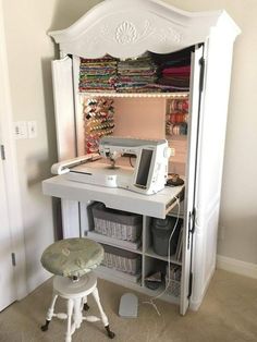 a white desk with a computer on top of it