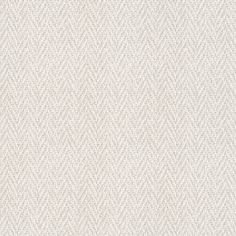 an upholstered white fabric textured with small, wavy lines on the surface