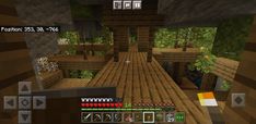 the inside of a minecraft house with lots of wood flooring and plants on it