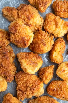 some fried food is sitting on wax paper