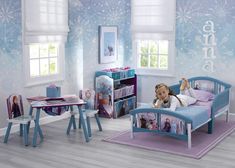 a child's bedroom with frozen princess furniture