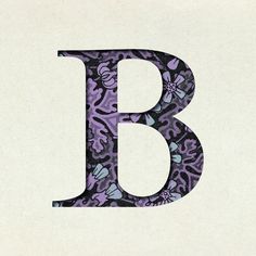 the letter b is made up of flowers and leaves in purple, black, and white