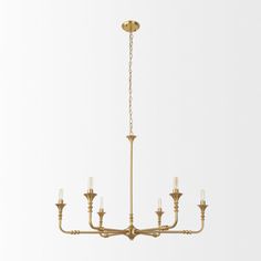 an antique brass chandelier with six candles hanging from the ceiling, on a white background