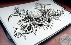 a spiral notebook with an intricate design on it