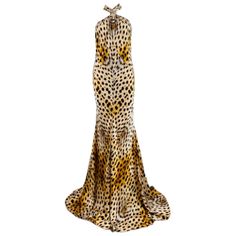 2007 Roberto Cavalli Silk Dress Gown Incredible cheetah print silk fabric Halter neckline with with long wide ties High neckline with hammered gold metal detail at the neck Form fitted style with wide flared mermaid hem Open upper back Hidden zipper up the back Unlined Marked 44, Measurements - Bust up to 18.5" (can fit larger due to totally open back, Waist 14.5-17", Hips 20" - 22", Length 64" in front 67" in back (taken from top of dress at top of gold hoop at neckline, dress is LONG!!!) /take Gold Dress Gown, Printed Silk Fabric, Silk Dressing Gown, Printed Halter Dress, Euro Summer, Maxi Gown Dress, Metal Detail, Neckline Dress, Fitted Style