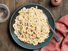 a bowl of macaroni and cheese on a wooden table