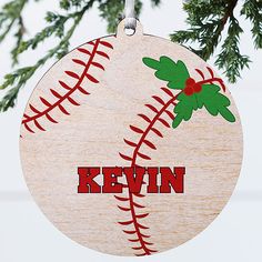 a wooden ornament hanging from a tree with the name kevin on it