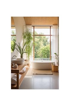 a bathroom with two sinks and a bathtub next to a large window in the corner