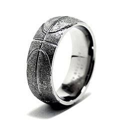 a silver ring with a basketball design on it