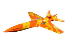 an orange and yellow jet flying through the air with camouflage paint on it's side