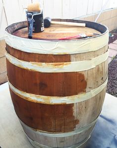 a wooden barrel sitting on top of a table