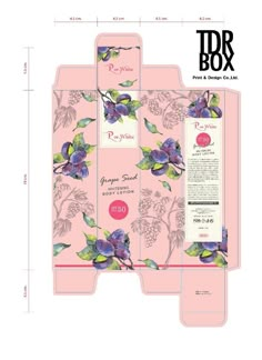 two boxes with flowers and leaves on them, one is open to show the packaging