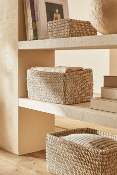 baskets and books on shelves in a room