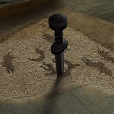 an artistic carpet with dragon designs on it and a wooden post in the middle,