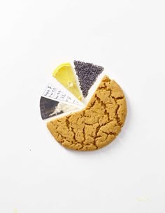 a cookie with different ingredients in it on a white surface, cut out into the shape of a pie