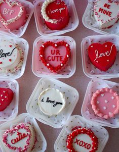 valentine's day cupcakes are arranged in plastic containers