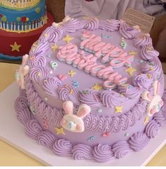 a birthday cake with the words happy birthday written in frosting and decorations on it