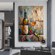 a wine bottle and two glasses on a table in front of a wall with an abstract painting