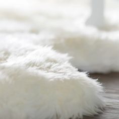 the fur is white and fluffy on the floor