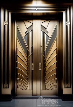 an art deco door in gold and black