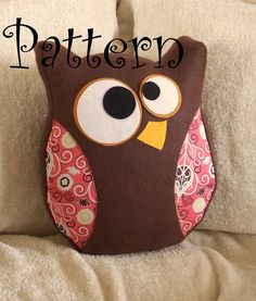 an owl pillow sitting on top of a white couch with the words pattern over it