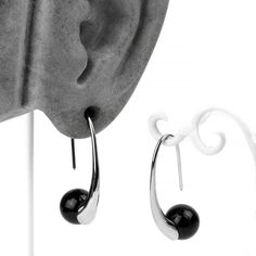 Gauge: 18g and #124; Color: Silver and #124; (pair). Sold as a pair. Enhance your look with these Sterling Silver Black Orb Hook Earrings. Crafted from quality material and featuring a black synthetic stone orb, they're a sophisticated addition for anyone with a basic ear piercing. This stylish accessory is a must-have for your everyday wear.All measurements are approximate: The entire ear hook measures 33mm tall by 10mm wide. Made from sterling silver. More earrings are available here. Material Modern Black Round Hoop Earrings, Modern Black Hypoallergenic Jewelry, Elegant Black Metal Teardrop Earrings, Black Sterling Silver Pearl Earrings For Formal Occasions, Modern Black Hypoallergenic Hoop Earrings, Modern Onyx Drop Earrings, Nickel-free Black Metal Plug Earrings, Modern Silver Earrings With Black Enamel, Black Teardrop Pearl Earrings Gift