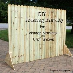 a wooden display for vintage markets and craft shows with the words diy folding display for vintage markets and craft shows