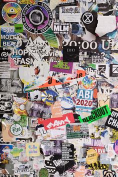 a wall covered in lots of different types of stickers