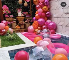 an outdoor party with balloons and decorations