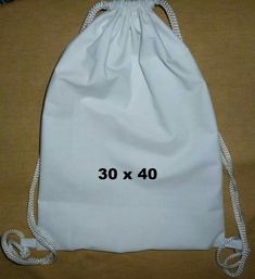 the drawstring bag is white and has 30 x 40 inches in length on it