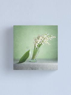 lily of the valley in a glass vase canvas print