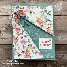 a handmade birthday card with flowers and birds on it, featuring the happy birthday bird