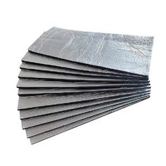 several pieces of aluminum foil are stacked on top of each other, with one being folded up