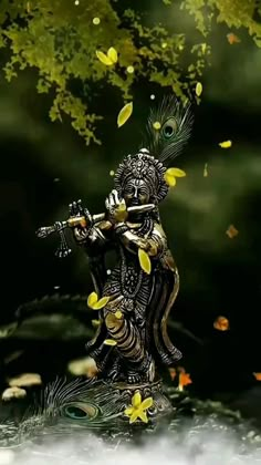 the statue is holding a flute in its hand and flying leaves all around it,