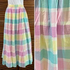 Adorable plaid midi fuller pleated skirt. Side zip and pockets. Fuller cut, free through hips. This hits about mid calf, maybe a bit longer on shorter figures. Beautiful pastel color combination and super vintage/preppy style. In excellent shape. This is all cotton, lightweight. Made by Carol Reed, size 12. Made in Japan. In excellent condition. Most likely a modern 8 or so, read measurements. Buttons on sides, can be moved for sizing.  Measures 34" in length x 15" across waist Vintage Plaid Summer Skirt, Madras Plaid, Vintage Preppy, Midi Length Skirts, Color Combination, Preppy Style, Mid Calf, Pleated Skirt, Midi Length