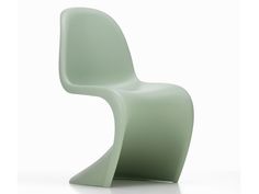 a green chair sitting on top of a white floor