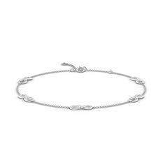 Station infinity loops adorn this simple and elegant adjustable ankle bracelet in 14k white gold. The iconic design is symbolic of all things infinite and limitless. Iconic Design, Ankle Bracelet, Ankle Bracelets, Icon Design, Solid Gold, Silver Bracelet, White Gold, Bracelet, Silver